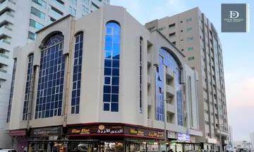 For sale in Sharjah, Al Qasimia Al Mahatta area, residential and commercial building, area of ​​7,300 square feet, corner on two streets, ground clearance, 4 floors, consisting of 26 apartments, each apartment has 2 bathrooms with a balcony and Mitsubishi